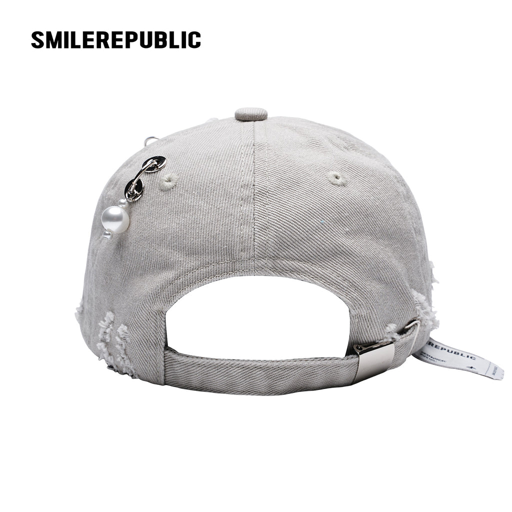 White Distressed Baseball Cap with Pearl Charm Accents, Logo Embroidery and Adjustable Strap