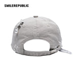 White Distressed Baseball Cap with Pearl Charm Accents, Logo Embroidery and Adjustable Strap