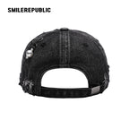 Black Distressed Denim Baseball Cap with Pearl-Tone Pendant and Metal Ring Details