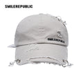 White Distressed Baseball Cap with Pearl Charm Accents, Logo Embroidery and Adjustable Strap
