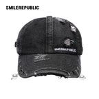 Black Distressed Denim Baseball Cap with Pearl-Tone Pendant and Metal Ring Details