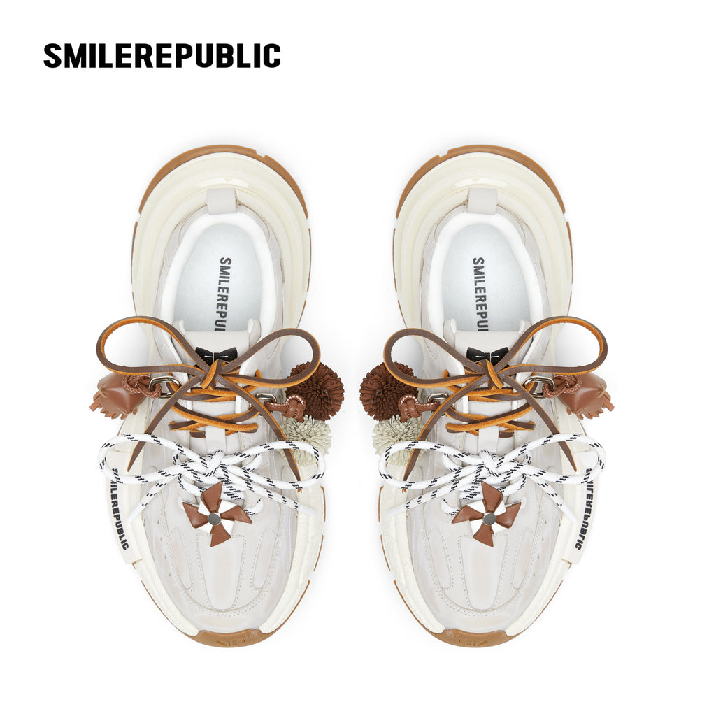 Off-White Burnished Leather Low Top Chunky Sneakers with Tassel Charms, Unisex