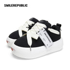 Black Canvas Interchangeable Smile Toe Chunky Platform Sneakers with Airplane Ticket Tag