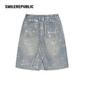 Denim Blue Metallic Coated Washed Denim Skirt with Asymmetric Front Slit and Raw Hem for Women