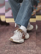 Off-White Burnished Leather Low Top Chunky Sneakers with Tassel Charms, Unisex